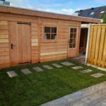 Overkapping, kunstgras en staptegels Afbeelding 1