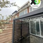 Veranda met een glazenschuifwand-systeem Afbeelding 1