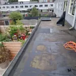 Plat dak weer als nieuw met een verse laag bitumen! 🏠 Afbeelding 1